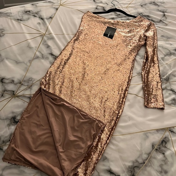 Dresses & Skirts - One shoulder Sequin dress with tag. High stretch- size M to Large